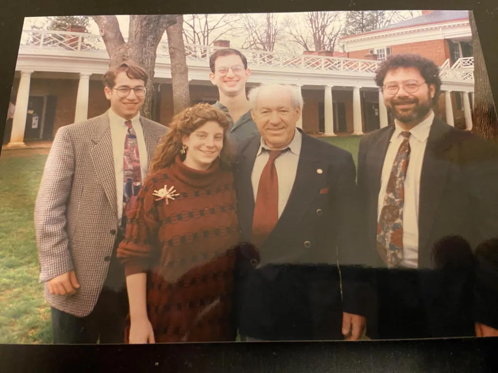 Scan of an old photo with Hillel alumni gathered together on campus