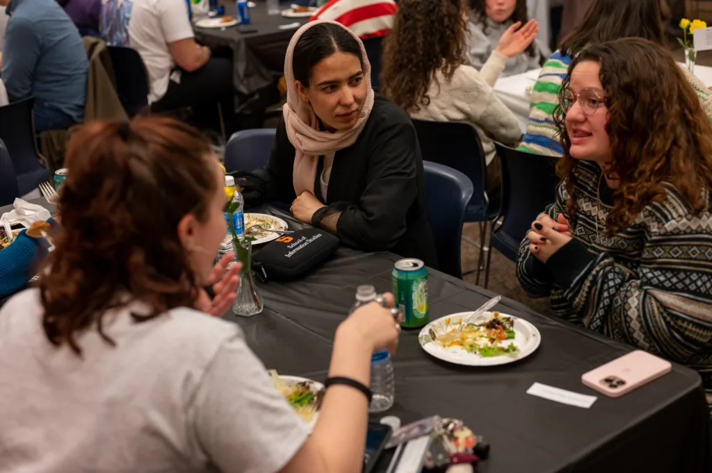 Students discuss their different faith identities at a multifaith Passover and Ramadan celebration